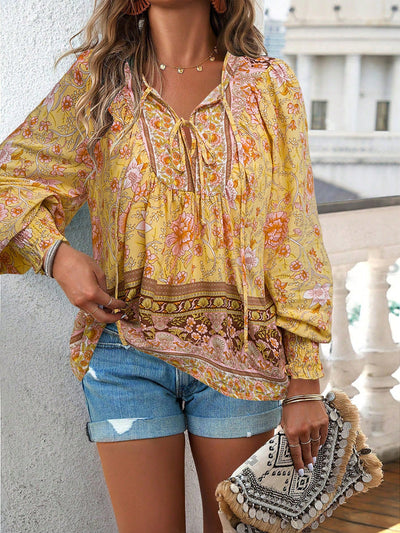 Blusa con lazo en el cuello y estampado floral bohemio